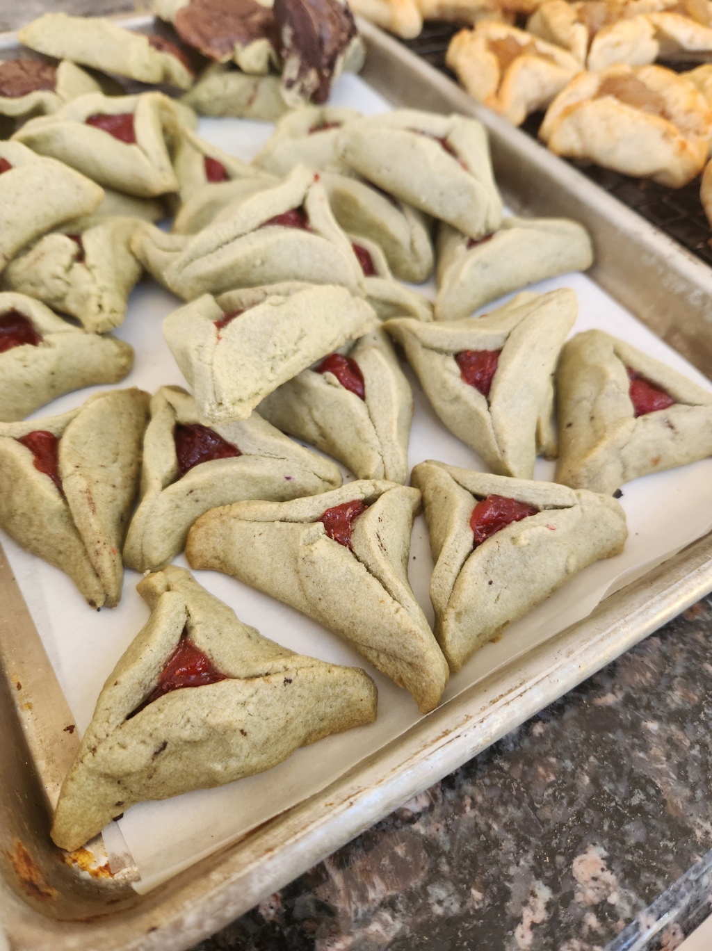 Matcha Hamantaschen with Strawberry filling.